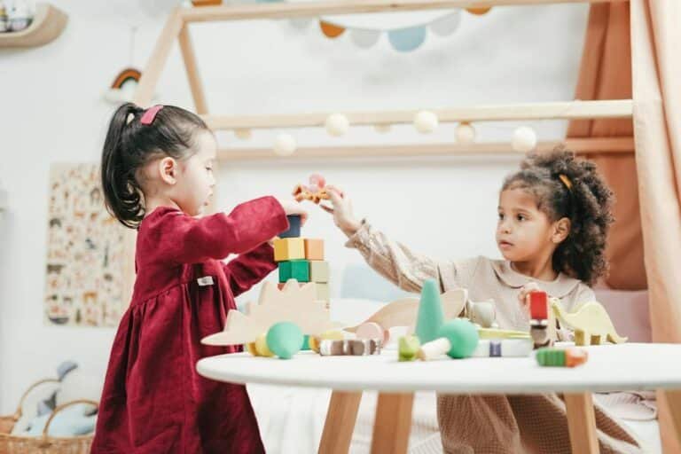 Girl In Red Dress Playing A wooden Blocks