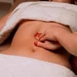 Masseur Giving Woman Stomach Massage